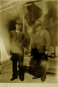 Virgil Stephens and Mr. Beal in front of the Okay Cafe, circa 1936